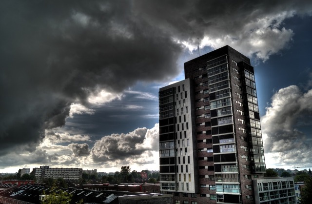 High rise block of flats and storm clouds